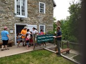 Museum Manager Nate Shank speaks with visitors at the Appalachian Trail Museum